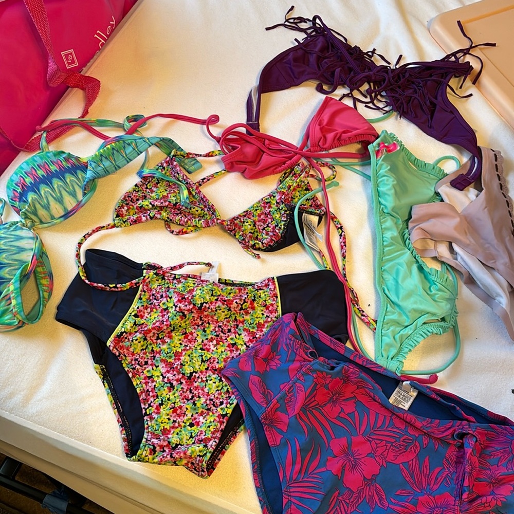 Different bathing suit pieces, ranging in size xsmall to medium